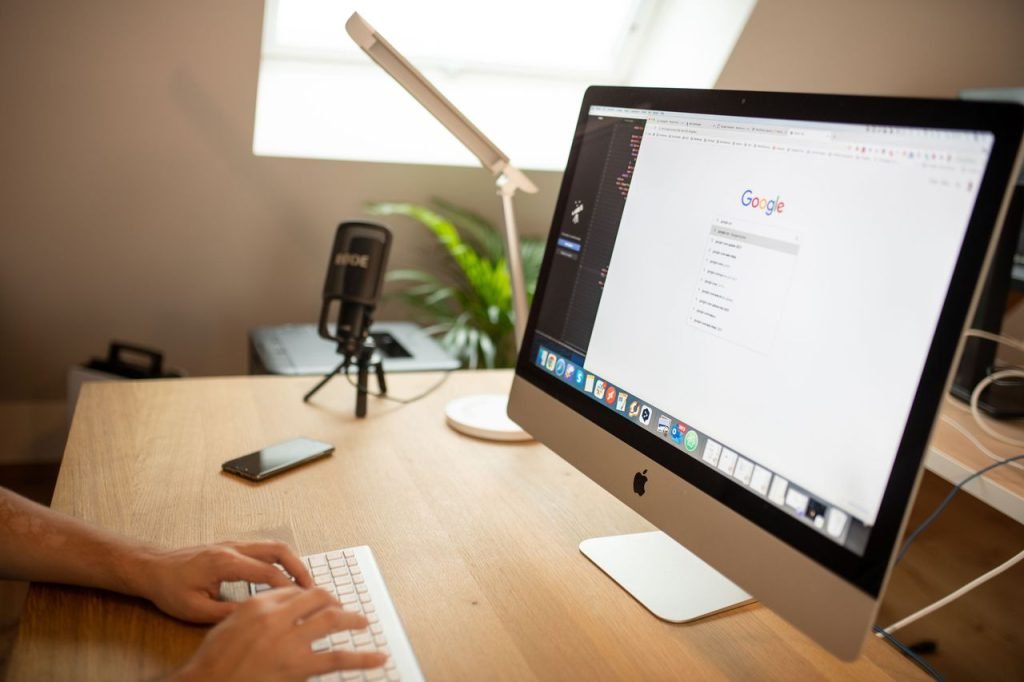 a-person-browsing-google-on-imac-10963241 A modern workspace with an iMac displaying Google search, perfect for remote work setups.